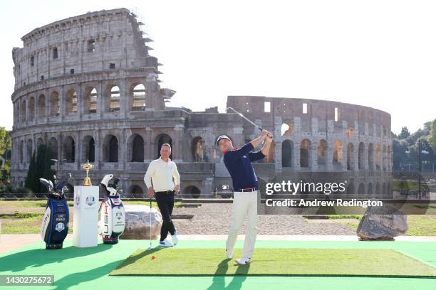 Team Captains Luke Donald of England and Zach Johnson of The United States pose for a photograph with the Ryder Cup Trophy at the Colosseum during...