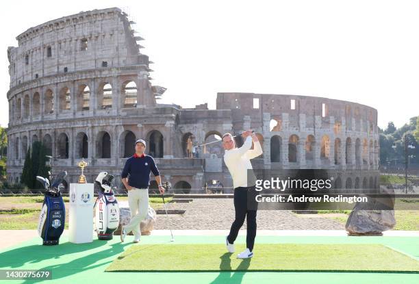 Team Captains Luke Donald of England and Zach Johnson of The United States pose for a photograph with the Ryder Cup Trophy at the Colosseum during...