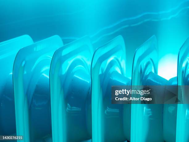 concept of energy crisis. close up of an electric radiator surrounded of electric energy. creative image. - electric heater stock pictures, royalty-free photos & images