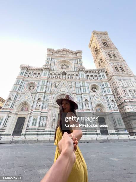 couple discovering florence, woman leading man - couple holding hands stock pictures, royalty-free photos & images
