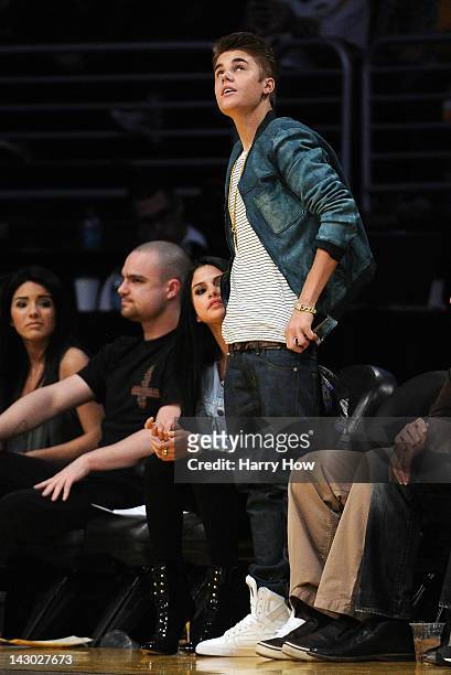 Justin Beiber and girlfriend Selena Gomez watch the game between the San Antonio Spurs and the Los Angeles Lakers at Staples Center on April 17, 2012...