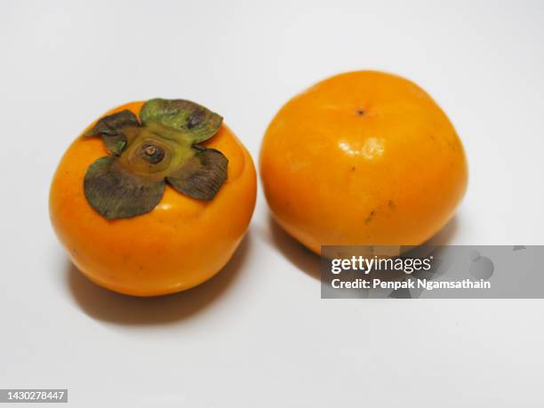 persimmon, diospyros yellow sweet fruit - amerikanische kakipflaume stock-fotos und bilder