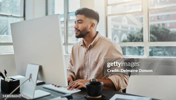 focus businessman, designer and computer planning, typing and strategy for working in modern office startup agency in turkey. young marketing creative at pc desktop reading email, internet and online - toestand stockfoto's en -beelden