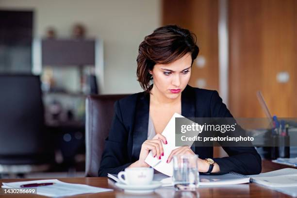portrait of businesswoman receiving bad new/being fired in an office - crisis response stock pictures, royalty-free photos & images