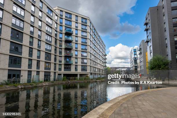 apartment buildings by the ashton canal, new islington, manchester, england - manchester uk stock pictures, royalty-free photos & images
