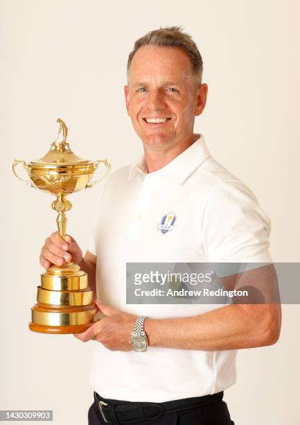 Luke Donald of England poses for a photograph with the Ryder Cup Trophy during the Ryder Cup 2023 Year to Go Media Event on October 04, 2022 in Rome,...