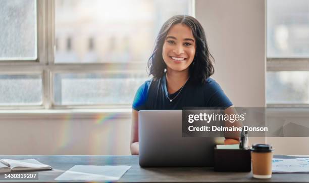 business woman, smile and working on laptop in office or company looking happy and satisfied. portrait of brazilian female worker or employee typing email on computer and planning strategy for vision - happy office workers stockfoto's en -beelden