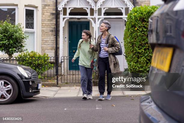 waiting to cross the road - cross road children stock pictures, royalty-free photos & images