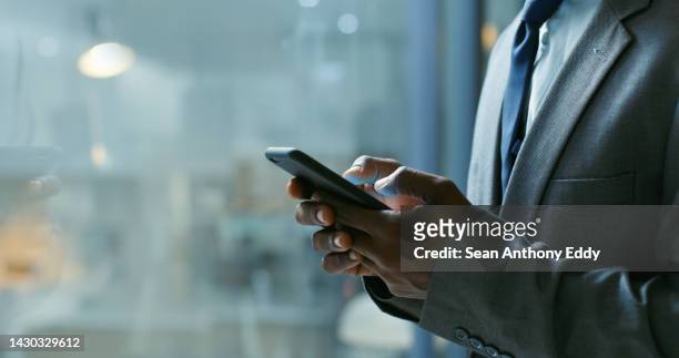 hands, phone and communication with a business man networking online with 5g mobile technology. internet, email and connectivity with a male employee sending a text message or chatting at night - twitter the company of tweets stockfoto's en -beelden