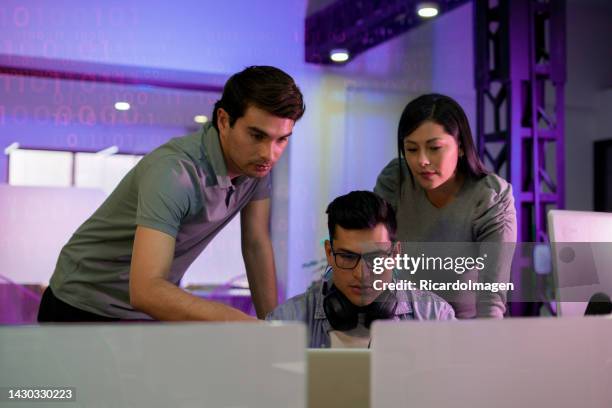 programming engineers are developing codes on their computers - gaming setup stock pictures, royalty-free photos & images