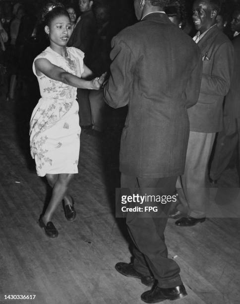 Dancers on the dancefloor of an nightclub, possibly the Savoy Ballroom, in the Harlem neighborhood of the Manhattan borough of New York City. New...