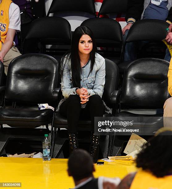 Selena Gomez attends a basketball game between the San Antonio Spurs and the Los Angeles Lakers at Staples Center on April 17, 2012 in Los Angeles,...