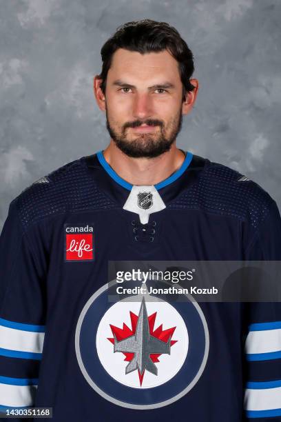 Connor Hellebuyck of the Winnipeg Jets poses for his official headshot for the 2022-2023 season on September 21, 2022 at Bell MTS Iceplex in...