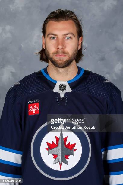 Kevin Stenlund of the Winnipeg Jets poses for his official headshot for the 2022-2023 season on September 21, 2022 at Bell MTS Iceplex in Winnipeg,...
