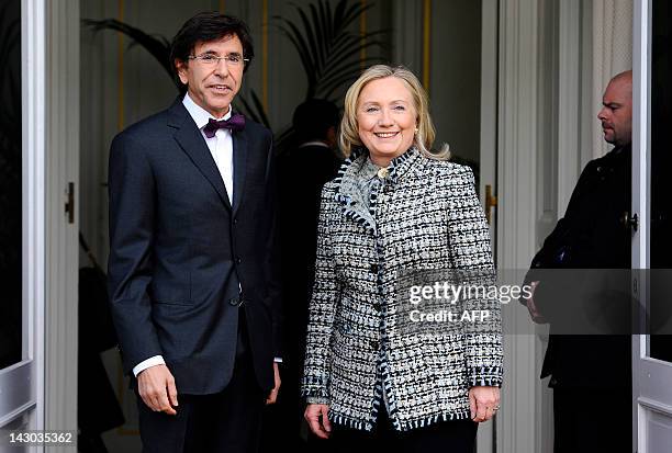 Belgian Prime Minister Elio Di Rupo and US Secretary of State Hillary Clinton pose on April 18, 2011 prior to their meeting at the Prime Minister's...