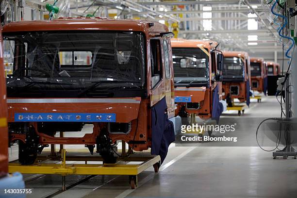 BharatBenz truck bodies are lined up at an assembly line at the new Daimler AG truck factory in Kancheepuram, India, on Wednesday, April 18, 2012....