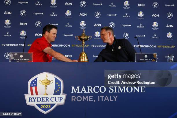 Team Captains Zach Johnson of The United States and Luke Donald of England shake hands during a press conference during the Ryder Cup 2023 Year to Go...