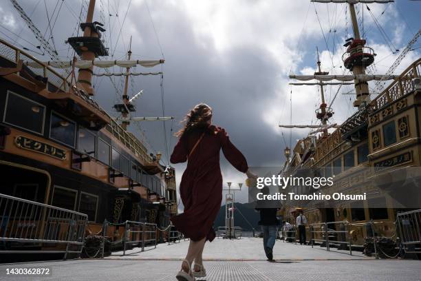 Tourists board a pirate ship cruise at a pier on Ashinoko Lake on October 04, 2022 in Hakone, Japan. Japan's Prime Minister Fumio Kishida unveiled a...