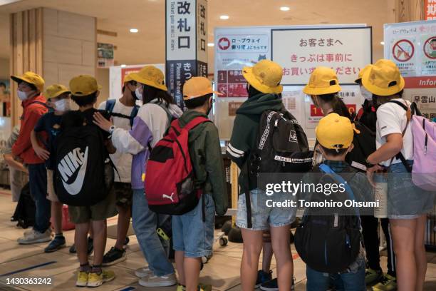 Children wait to ride a cable car on October 04, 2022 in Hakone, Japan. Japan's Prime Minister Fumio Kishida unveiled a multi-billion dollar package...