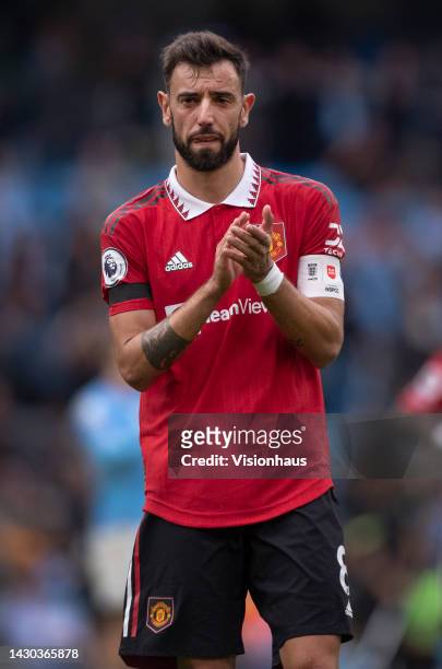 Bruno Fernandes of Manchester United applauds the fans after the Premier League match between Manchester City and Manchester United at Etihad Stadium...