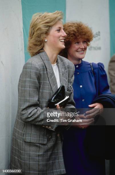 Princess Diana wearing a Glen Plaid blazer, and her sister Lady Sarah McCorquodale attend Burghley Horse Trials at Burghley House near Stamford,...