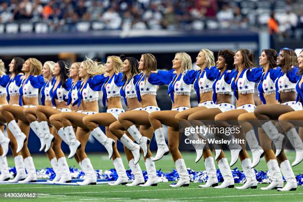 Dallas Cowboy Cheerleaders perform during a game against the Washington Commanders at AT&T Stadium on October 2, 2022 in Arlington, Texas. The...