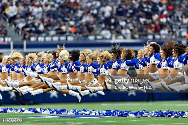 Dallas Cowboy Cheerleaders perform during a game against the Washington Commanders at AT&T Stadium on October 2, 2022 in Arlington, Texas. The...