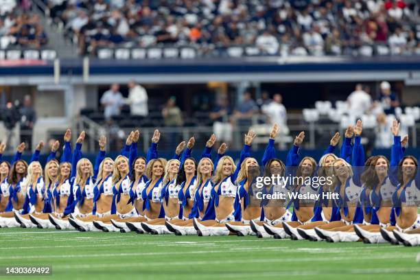 Dallas Cowboy Cheerleaders perform during a game against the Washington Commanders at AT&T Stadium on October 2, 2022 in Arlington, Texas. The...