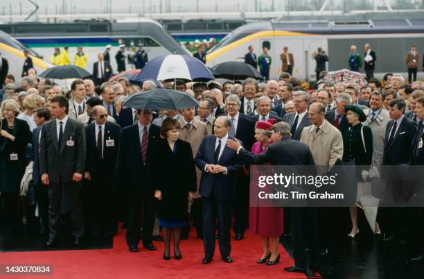 Queen Elizabeth II and President Francois Mitterrand during the Inauguration of the Channel Tunnel under Manche In France, 6th May 1994.