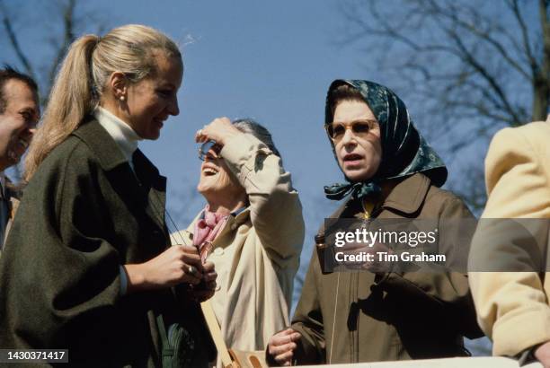 Queen Elizabeth II talks with Princess Michael of Kent as they watch the Badminton Trails, United Kingdom, 19th April 1980.