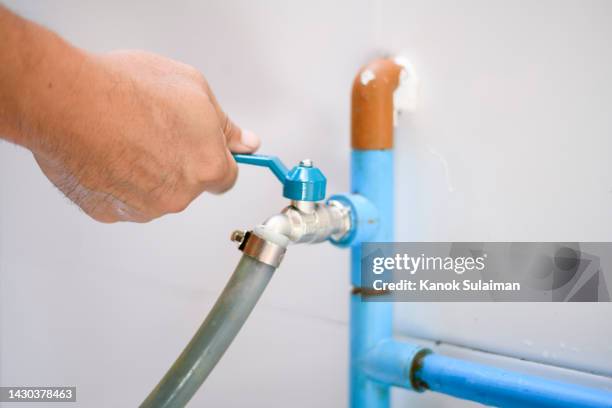 hand opening faucet - outdoor faucet repair stock pictures, royalty-free photos & images