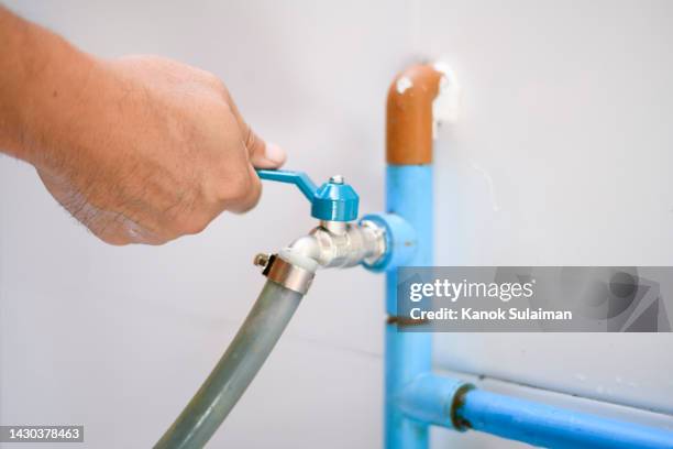 hand opening faucet - machine valve stock pictures, royalty-free photos & images