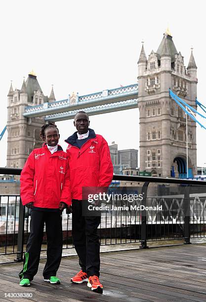 Returning champions Emmanuel Mutai of Kenya and Mary Keitany of Kenya pose in front of Tower Bridge during a Virgin London Marathon 2012 photo call...