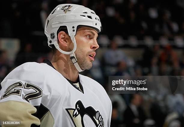 Craig Adams of the Pittsburgh Penguins skates against the New York Islanders at Nassau Veterans Memorial Coliseum on March 29, 2012 in Uniondale, New...