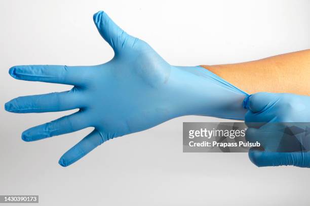 blue nitrile gloves - red glove stockfoto's en -beelden