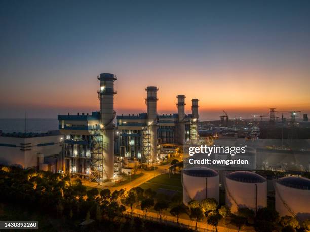 aerial view of natural gas fired electrical power plant at sunset - gas works stock pictures, royalty-free photos & images