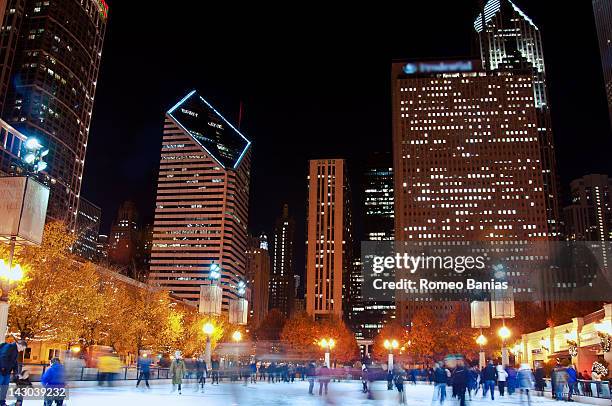 skating rink at night - chicago millennium park stock-fotos und bilder