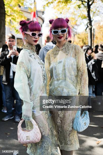 Ami Suzuki and Aya Suzuki attend the Miu Miu Womenswear Spring/Summer 2023 show as part of Paris Fashion Week on October 04, 2022 in Paris, France.
