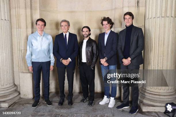 Frédéric Arnault, Bernard Arnault, designer Nicolas Ghesquière, Jean Arnault and Alexandre Arnault pose backstage after the Louis Vuitton Womenswear...