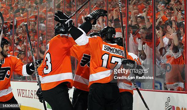 Andreas Lilja, Pavel Kubina, Wayne Simmonds, and Danny Briere of the Philadelphia Flyers celebrate Briere's second goal of the first period against...