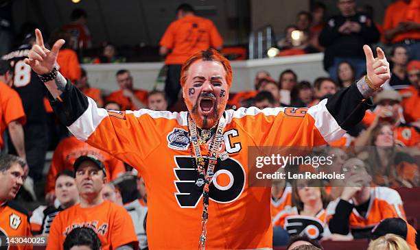 Fan of the Philadelphia Flyers cheers his team on against the Pittsburgh Penguins in Game Three of the Eastern Conference Quarterfinals during the...