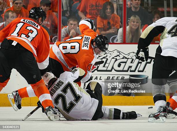Danny Briere of the Philadelphia Flyers battles Craig Adams of the Pittsburgh Penguins on a face-off in Game Three of the Eastern Conference...