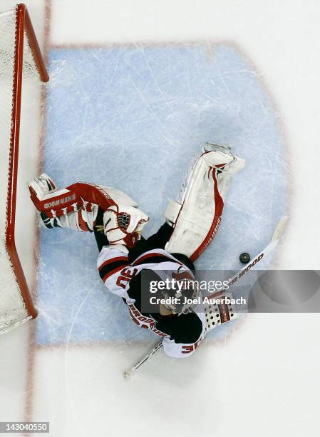 Goaltender Martin Brodeur of the New Jersey Devils stops a shot by the Florida Panthers in Game Two of the Eastern Conference Quarterfinals during...