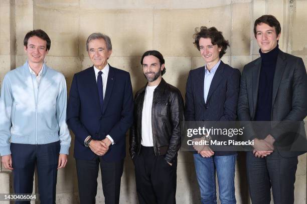 Frédéric Arnault, Bernard Arnault, designer Nicolas Ghesquière, Jean Arnault and Alexandre Arnault pose backstage after the Louis Vuitton Womenswear...