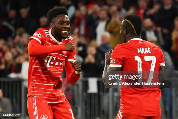 Sadio Mane celebrates with Alphonso Davies of Bayern Munich after scoring their team's third goal during the UEFA Champions League group C match...