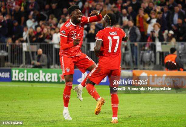 Sadio Mane celebrates with Alphonso Davies of Bayern Munich after scoring their team's third goal during the UEFA Champions League group C match...
