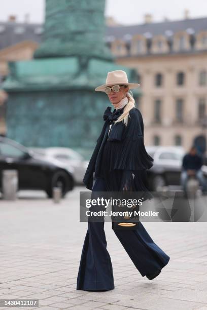 Denisa Palsha is seen wearing a total Zimmermann look with a bag by Schiaparelli, before the Zimmermann show during Paris Fashion Week on October 03,...