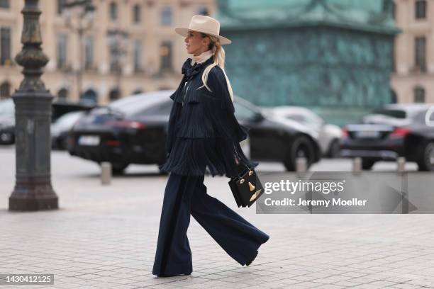 Denisa Palsha is seen wearing a total Zimmermann look with a bag by Schiaparelli, before the Zimmermann show during Paris Fashion Week on October 03,...