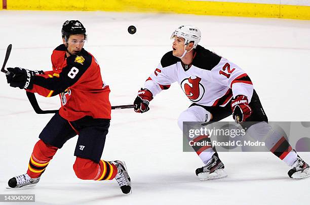 Alexei Ponikarovsky of the New Jersey Devils and Wojtek Wolski of the Florida Panthers go after the puck in Game Two of the Eastern Conference...