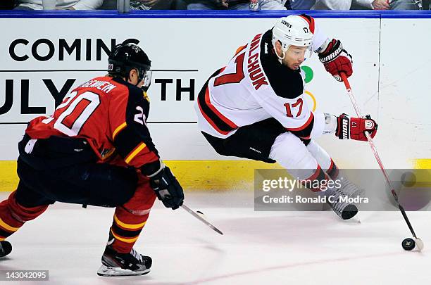 Ilya Kovalchuk of the New Jersey Devils skates with the puck as Sean Bergenheim of the Florida Panthers chases in Game Two of the Eastern Conference...